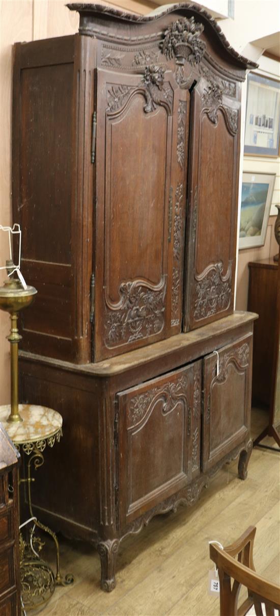 An oak four door French cupboard W.140cm